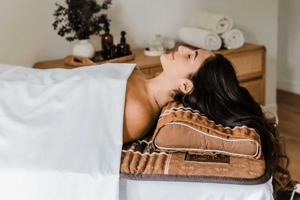 Person using the BioMat Professional 7000MX Infrared Mat