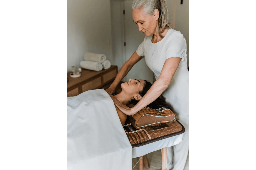 Massage therapist using the Biomat 7000Mx Professional
