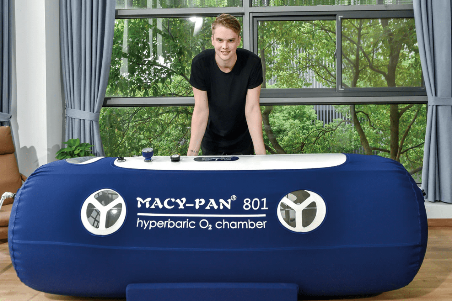 Macy Pan 801 Soft Lying chamber with a person posing behind the unit
