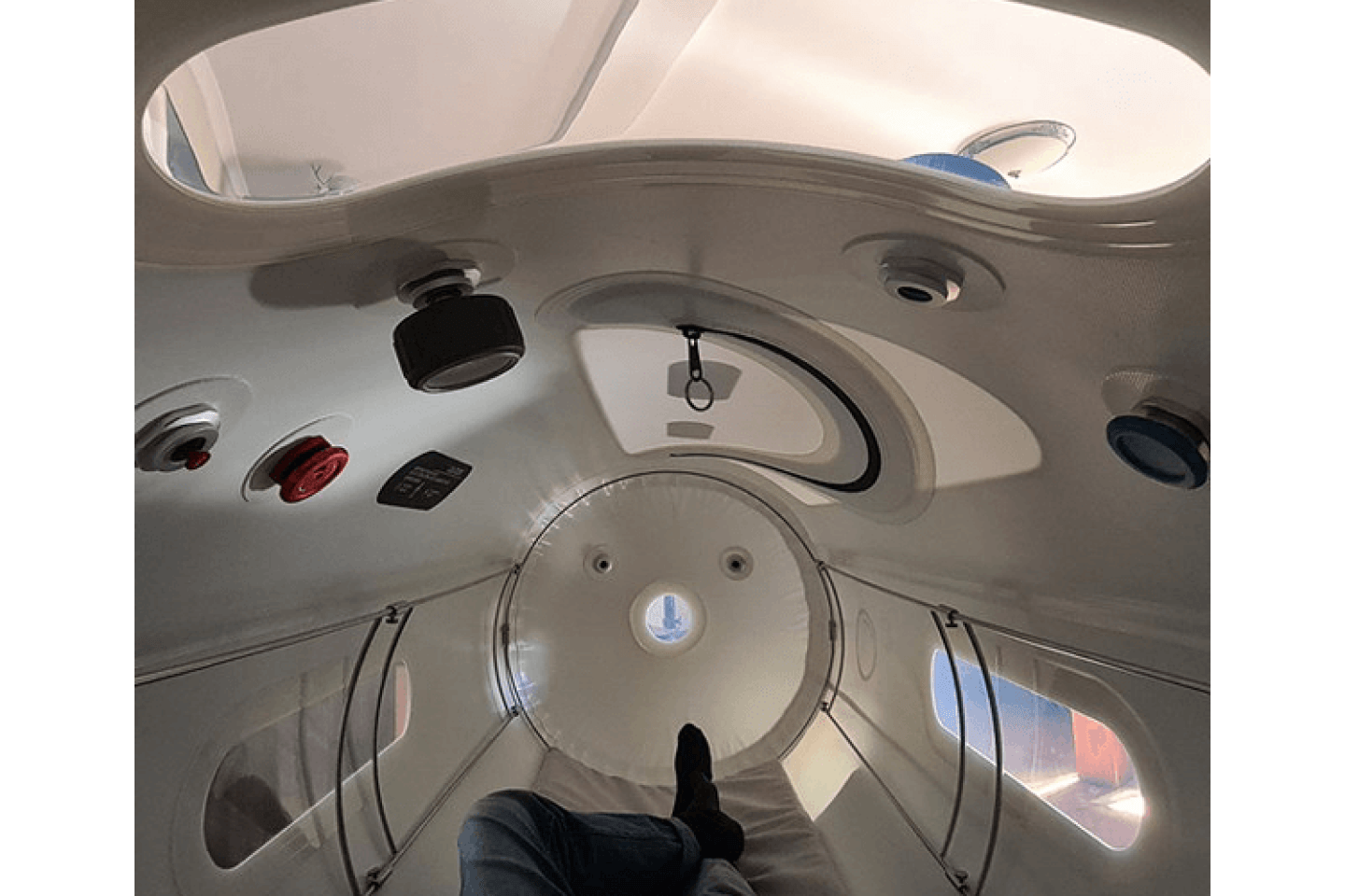 Oxyrevo Home Hyperbaric Chamber with its large windows, safety release valve, and reading gauge in internal view