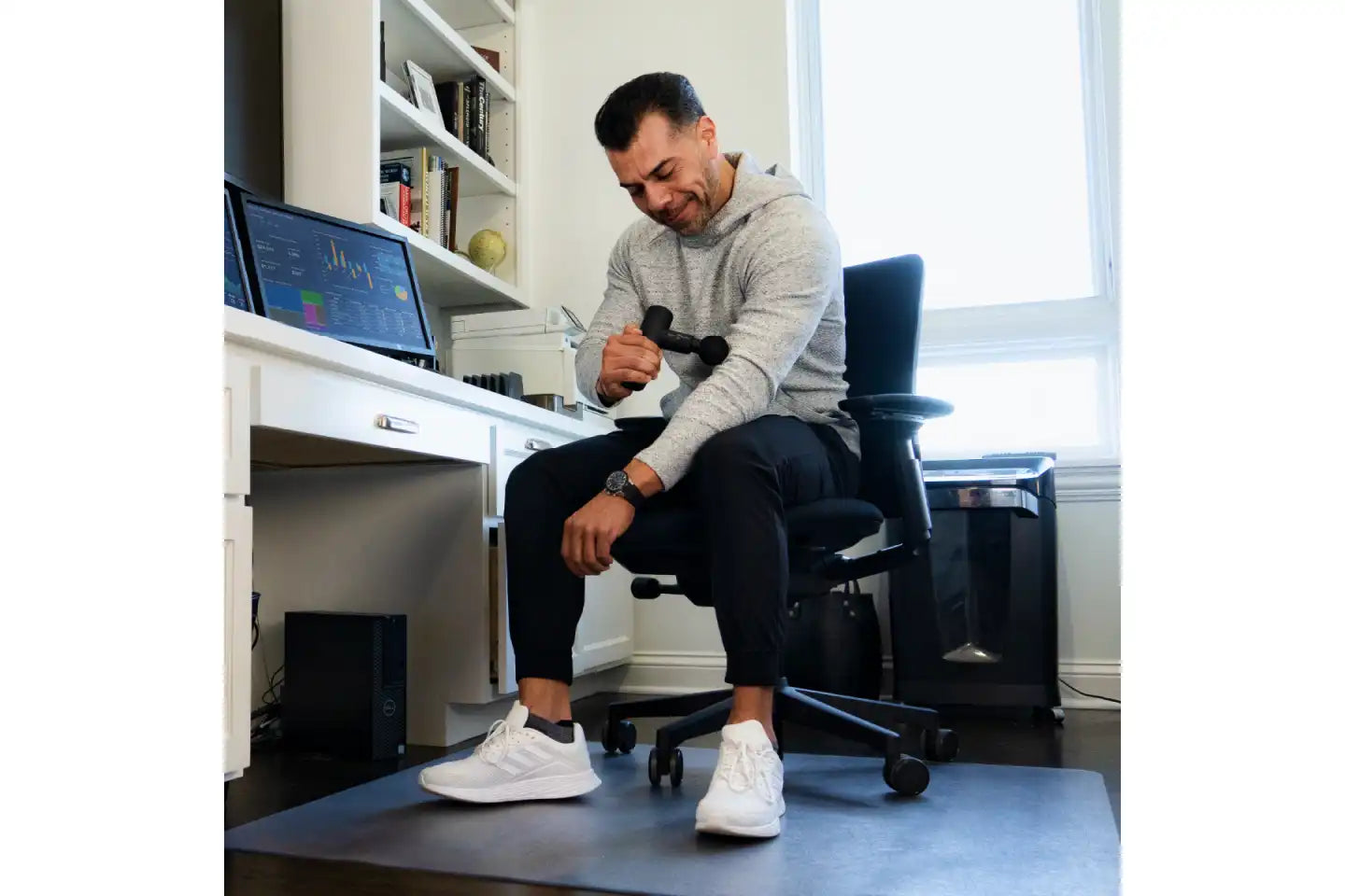 Power Plate Massage Gun in use