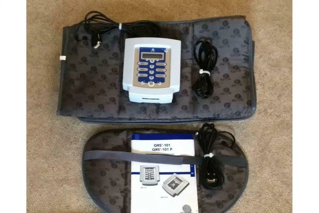 Qrs Pemf Mat control panel with its user manual and power supply cable