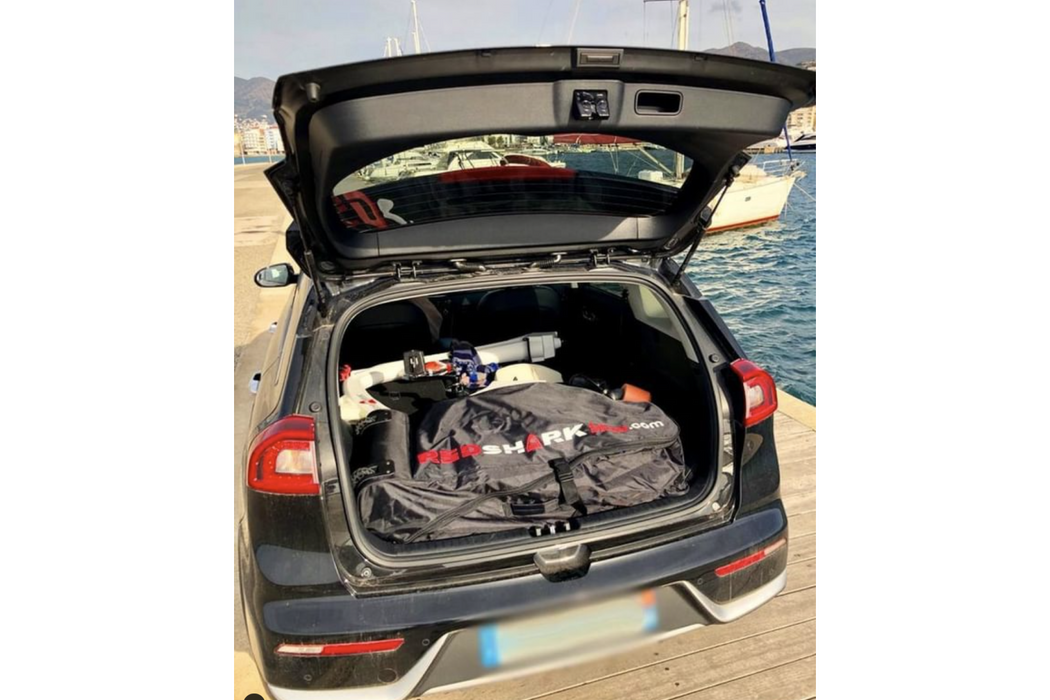Red Shark Sea Scooter in the bag inside the car trunk