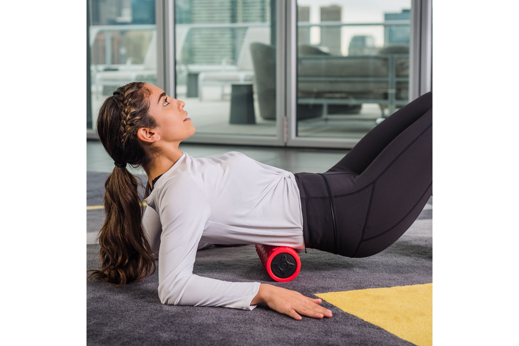 Person using the Power Plate Exercise Roller in its lower body back portion