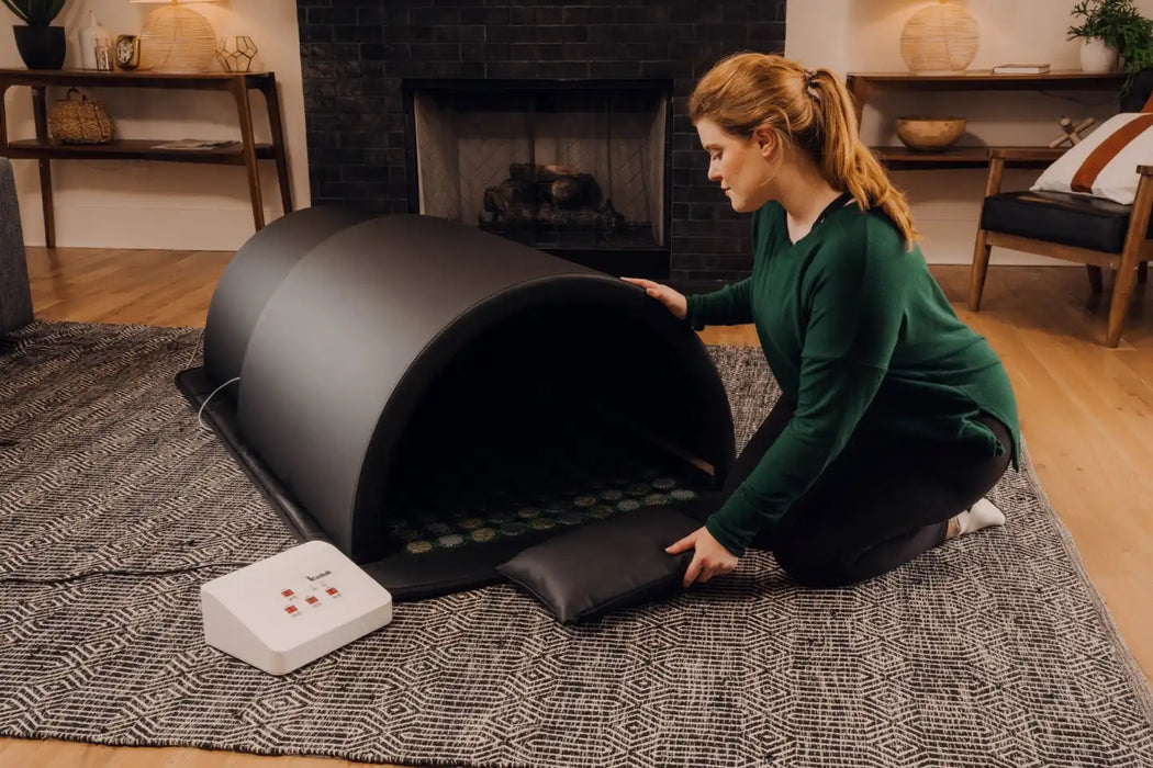 1Love Health Luxor ZERO XL 360 Far Infrared Sauna Dome with Mat and Stones, woman using the 1Love Sauna Dome