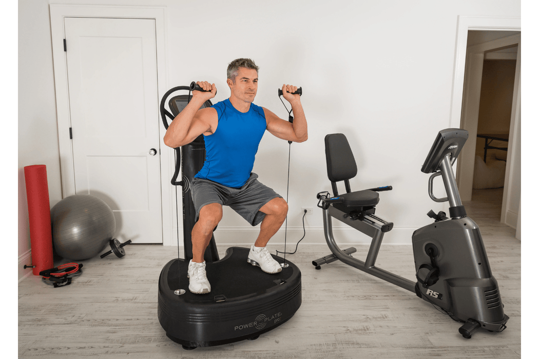 Person using the Power Plate Vibration pro 7 black color