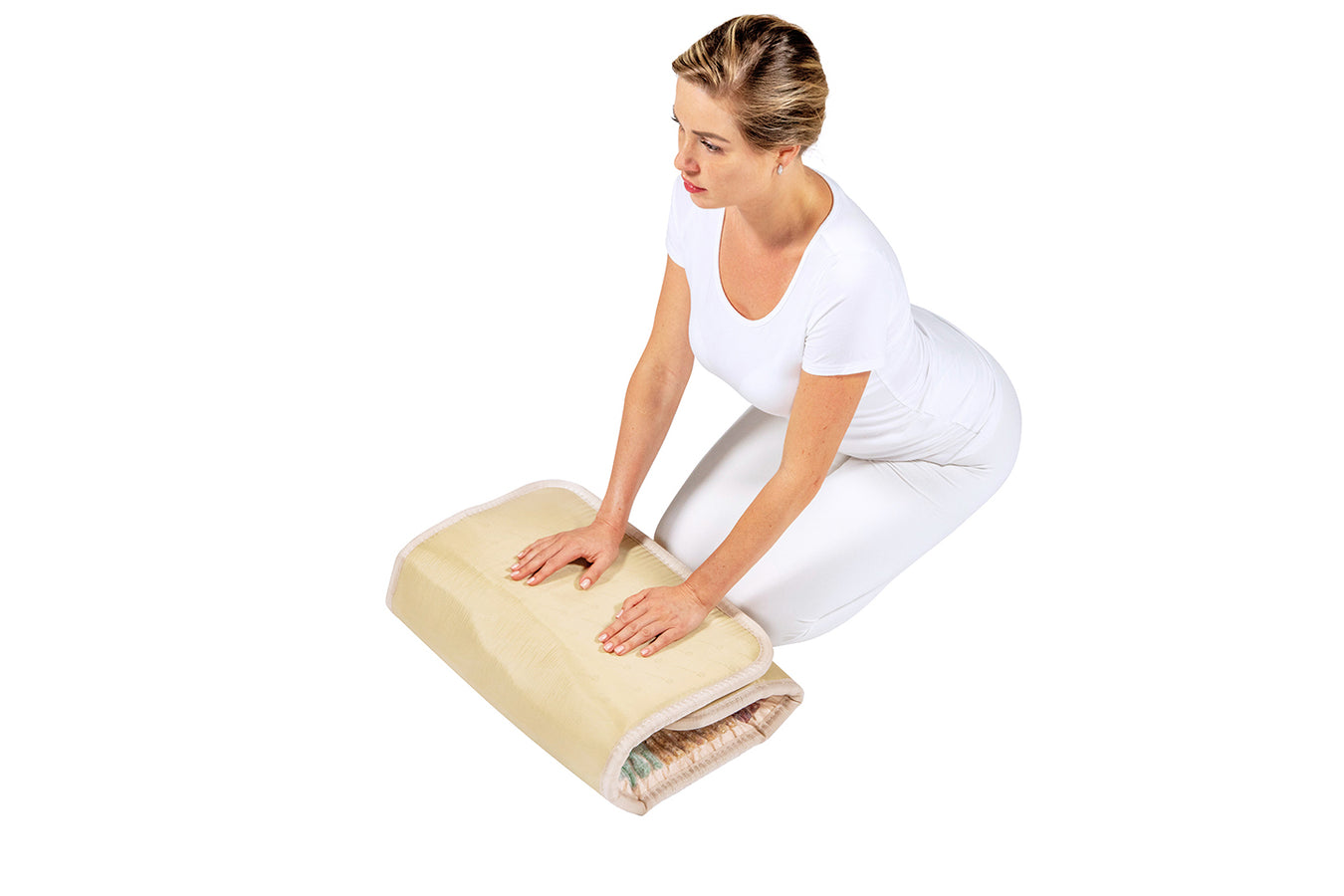 Woman folding the Healthyline Infrared Small Mat