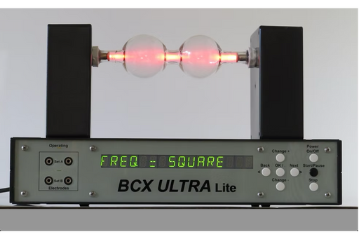 BCX Ultra Lite electronic device with digital display and glowing red lights on a gray background