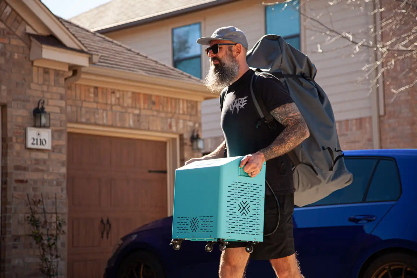 Cryospring Cold + Hot Plunge System, person carrying matte cryoblue