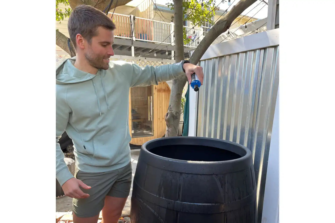 Person Using the Ice Barrel Bath Maintenance Kit