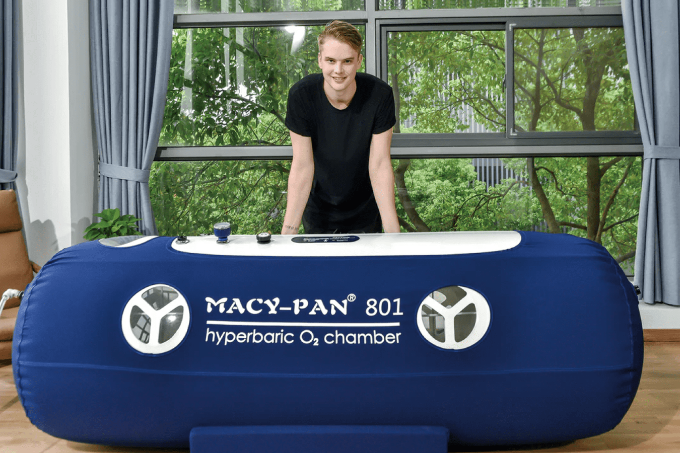 Macy Pan 801 Soft Lying chamber with a person posing behind the unit