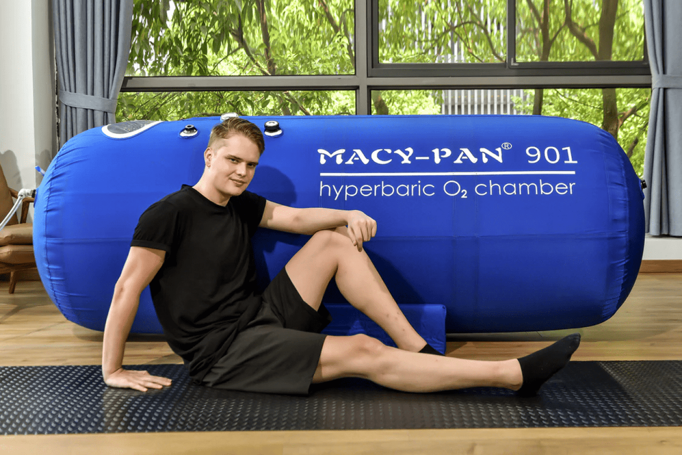 Man beside the Macypan St901 Hyperbaric Chamber