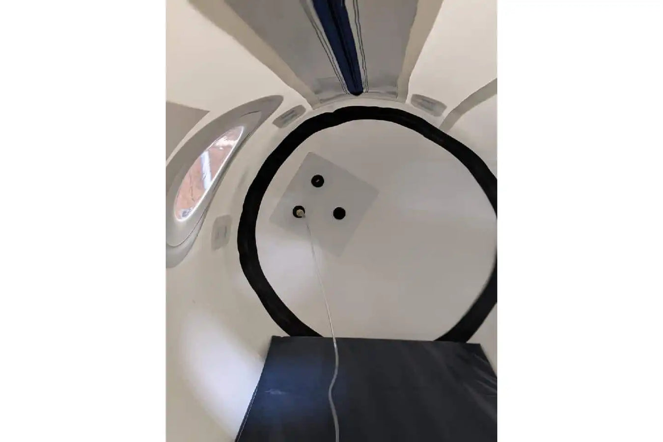 Interior view of Newtowne Hyperbarics Usa Chamber with dual airtight safety zippers and a viewing window