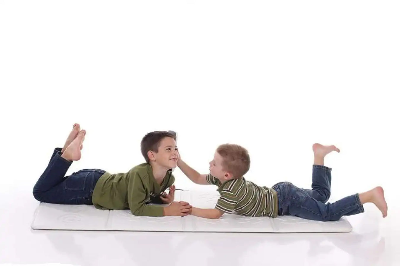 Kids enjoying using the Omi Pemf Therapy Mat