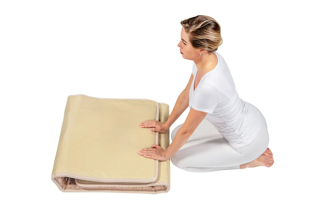 User folding the Healthyline Inframat Pro Large