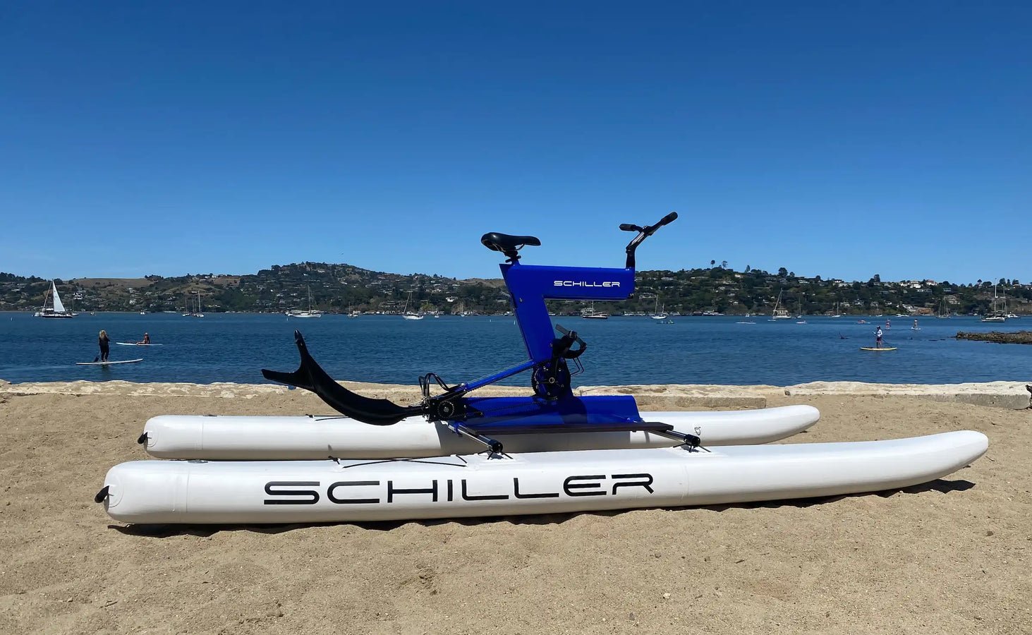 Schiller S1-C Water Bike with blue body frame setting in the beach sand