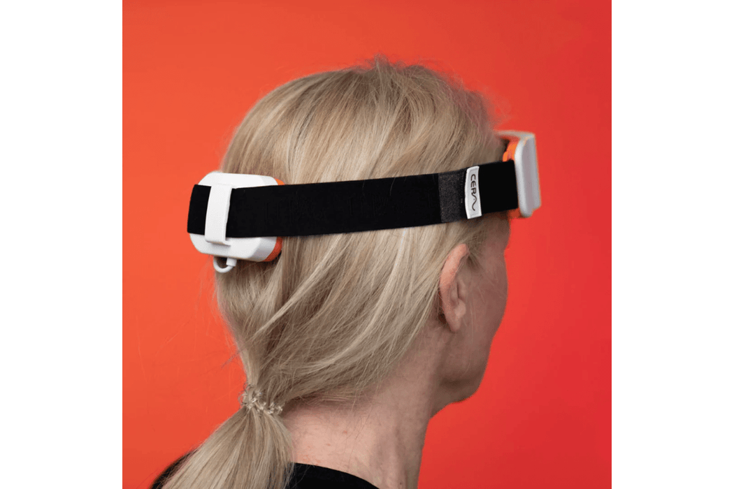 The CERA System Brain & Gut Red Light Therapy Device on the head
