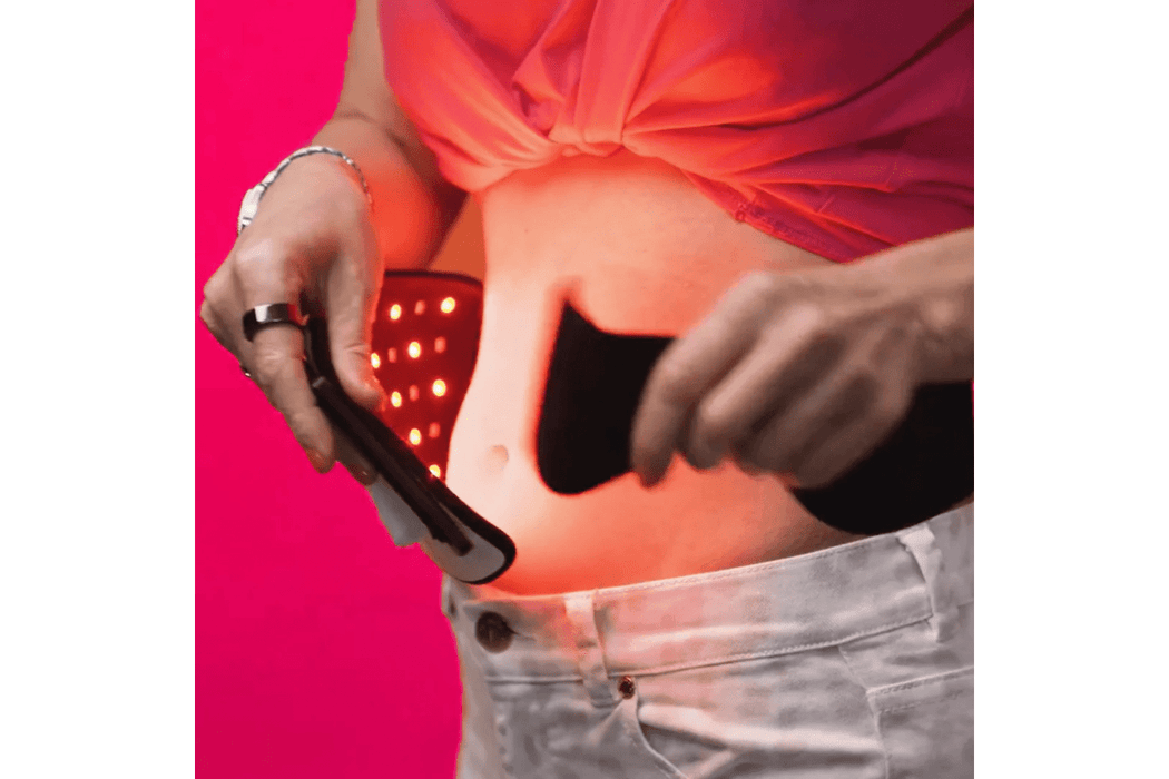The CERA System Brain & Gut Red Light Therapy Device being wrapped on the abdomen