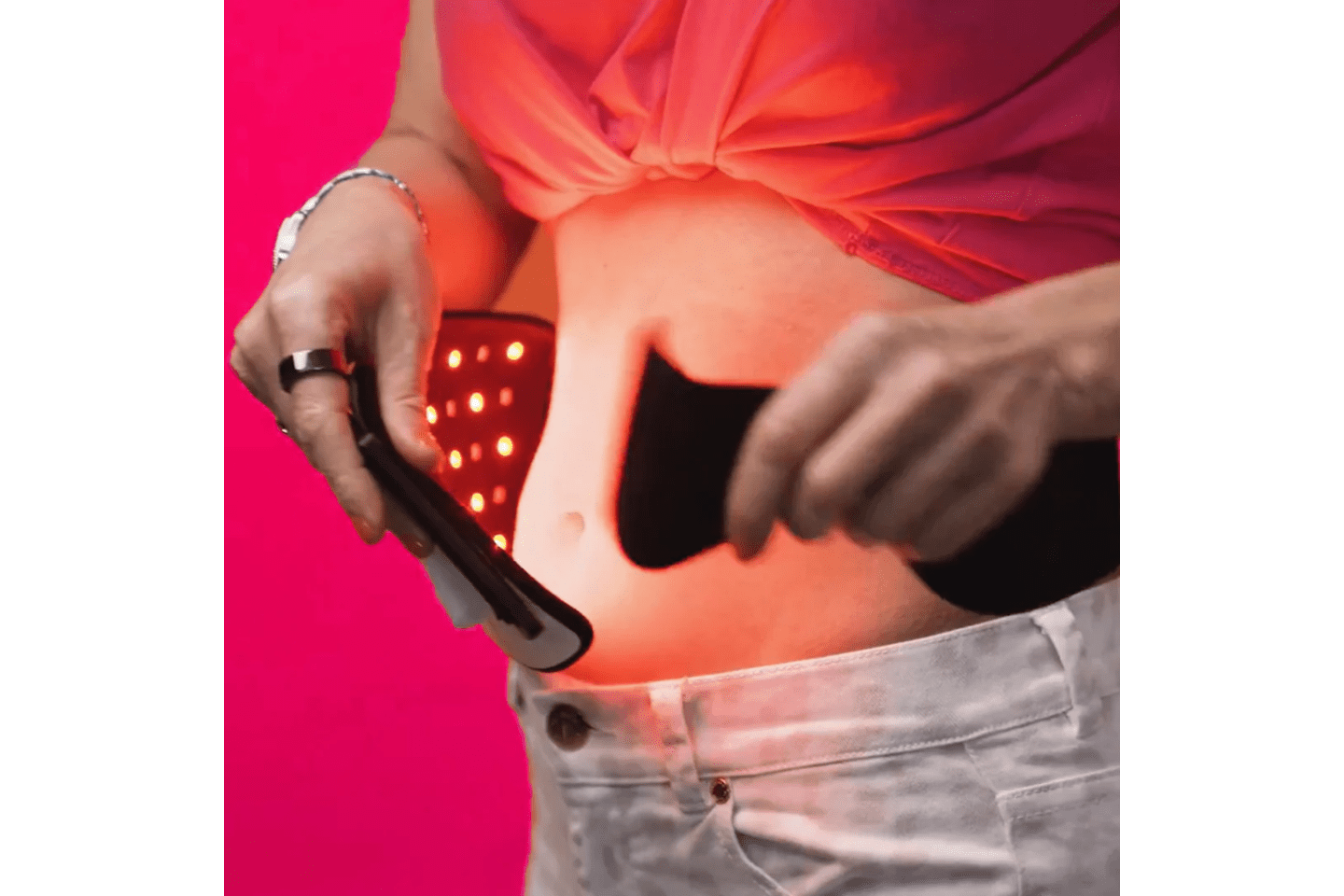 The CERA System Brain & Gut Red Light Therapy Device being wrapped on the abdomen
