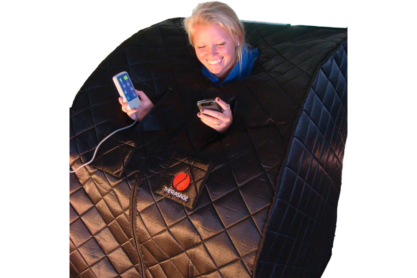 Person using the Therasage Indoor Sauna For Home, person's head and two hands are sticking out from the sauna, allowing them to use their phone and controller