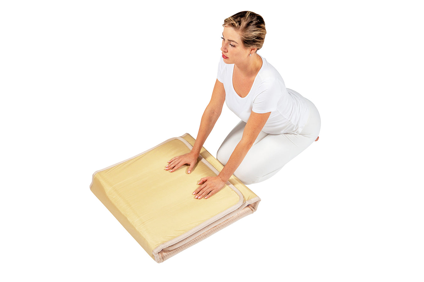 Person folding the Healthyline Taj Mat