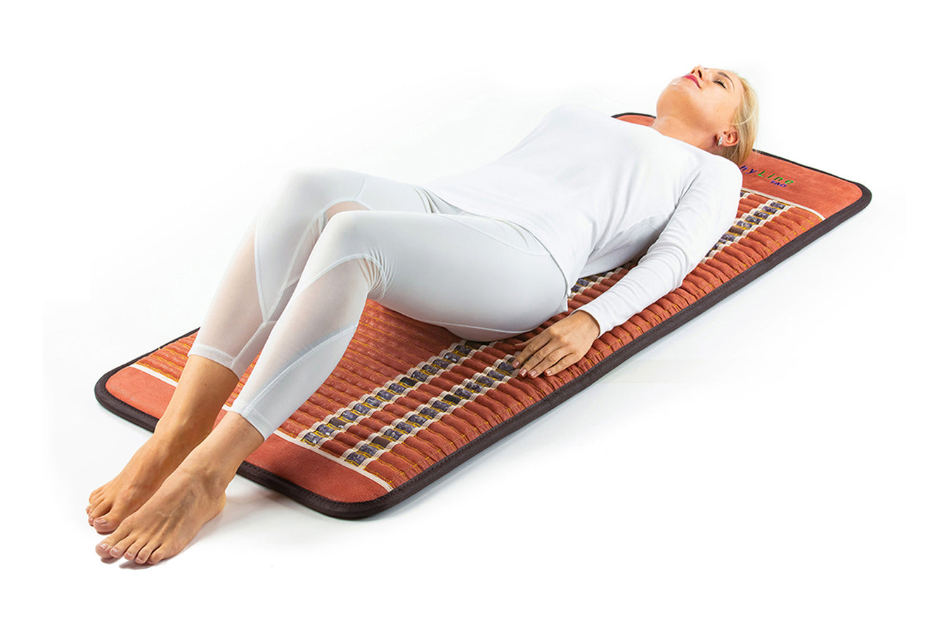 Person Using The Healthyline Pemf Mat Pro