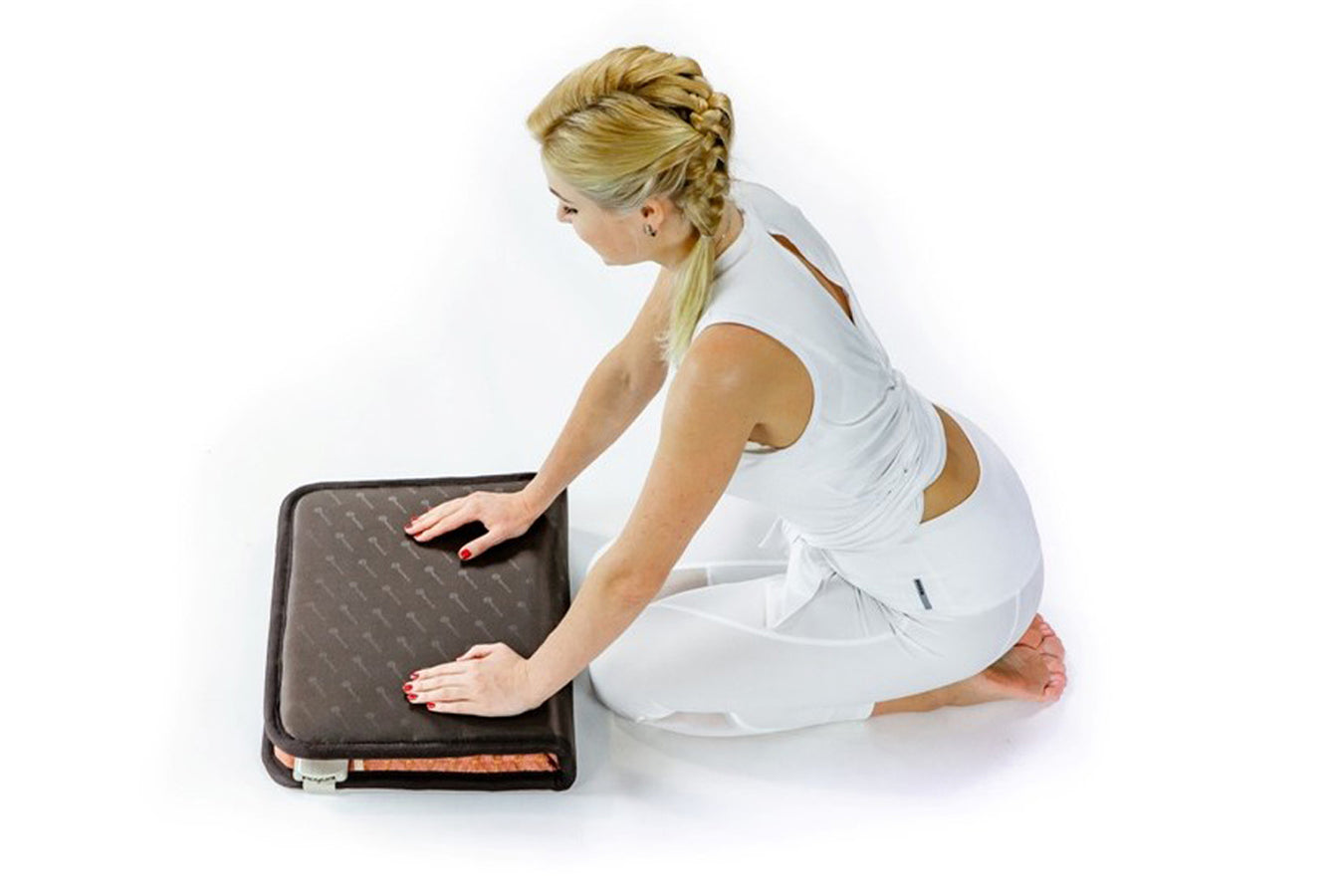 Person folding the HealthyLine TAO-Mat Medium 3220 Firm