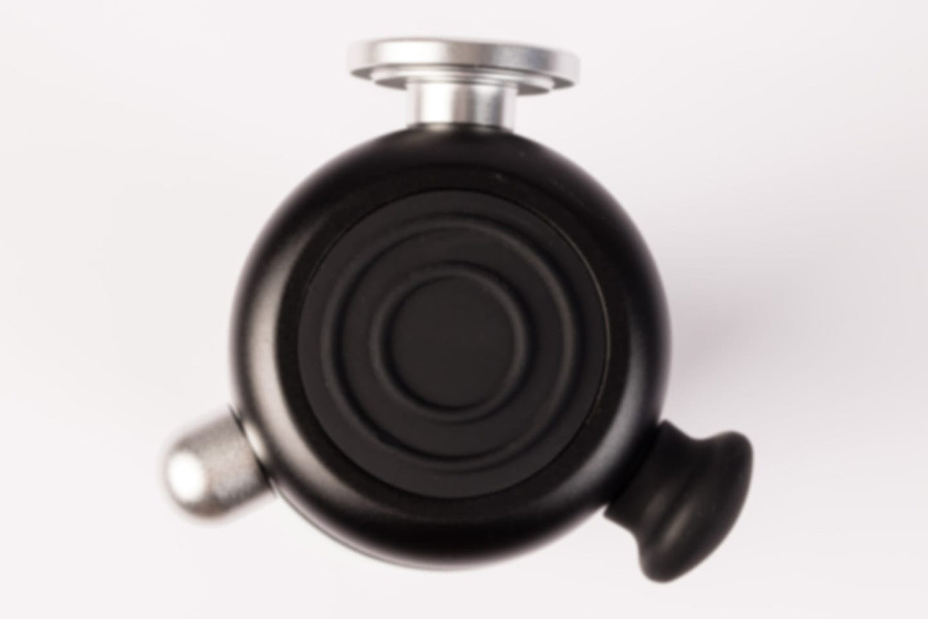 Top view of the Rapid Release Traveler showing the round treatment disk and attachment tips