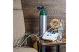 Stratus 3.0 Complete Kit set up beside an armchair, including the oxygen tank, ozone generator, and water bubbler system