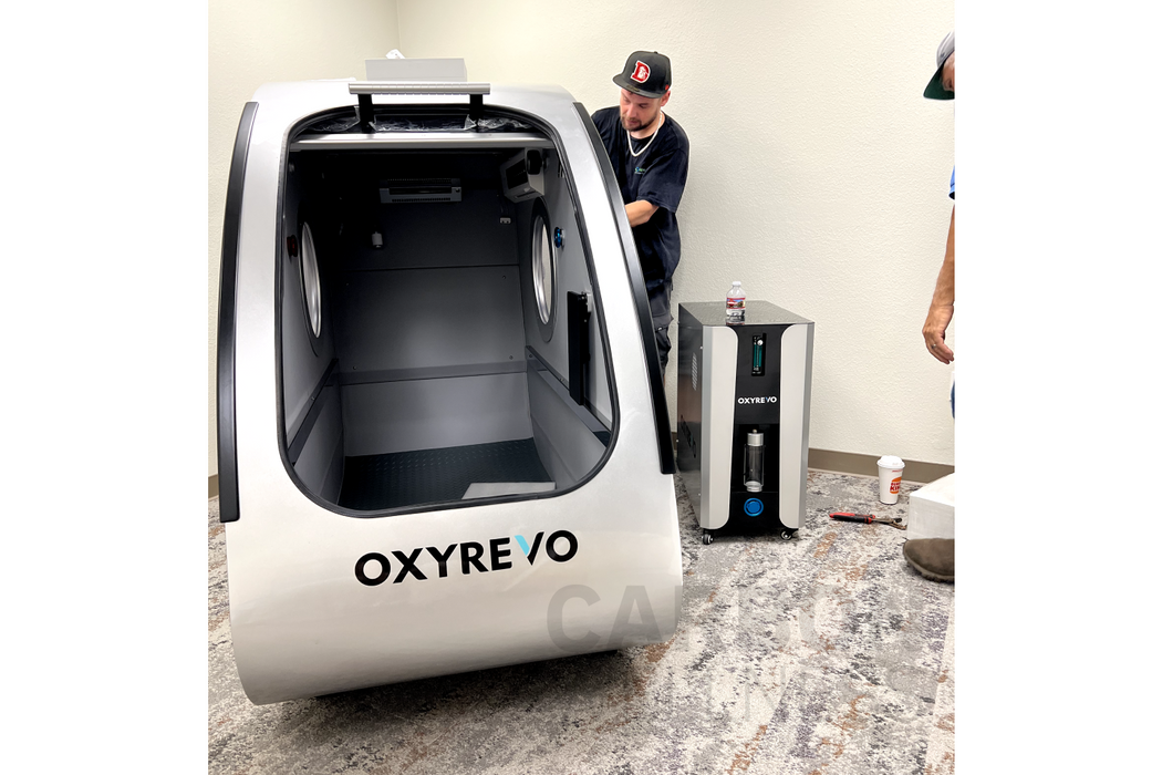 Person assembling the oxyrevo space60 hbot therapy chamber