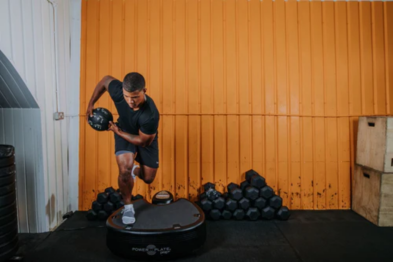 Person using the Power Plate Vibration Platform