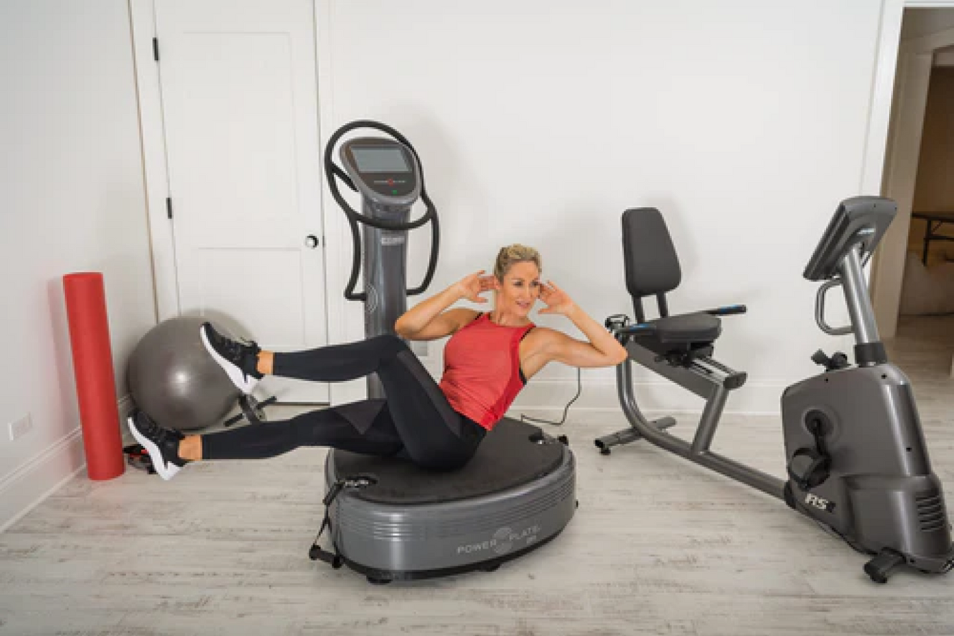 Person enjoying workout with the Power Plate Vibration Platform