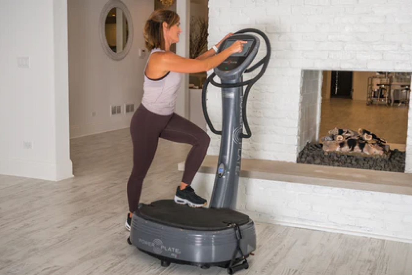 Person accessing the Power Plate Machine LCD touch screen controls