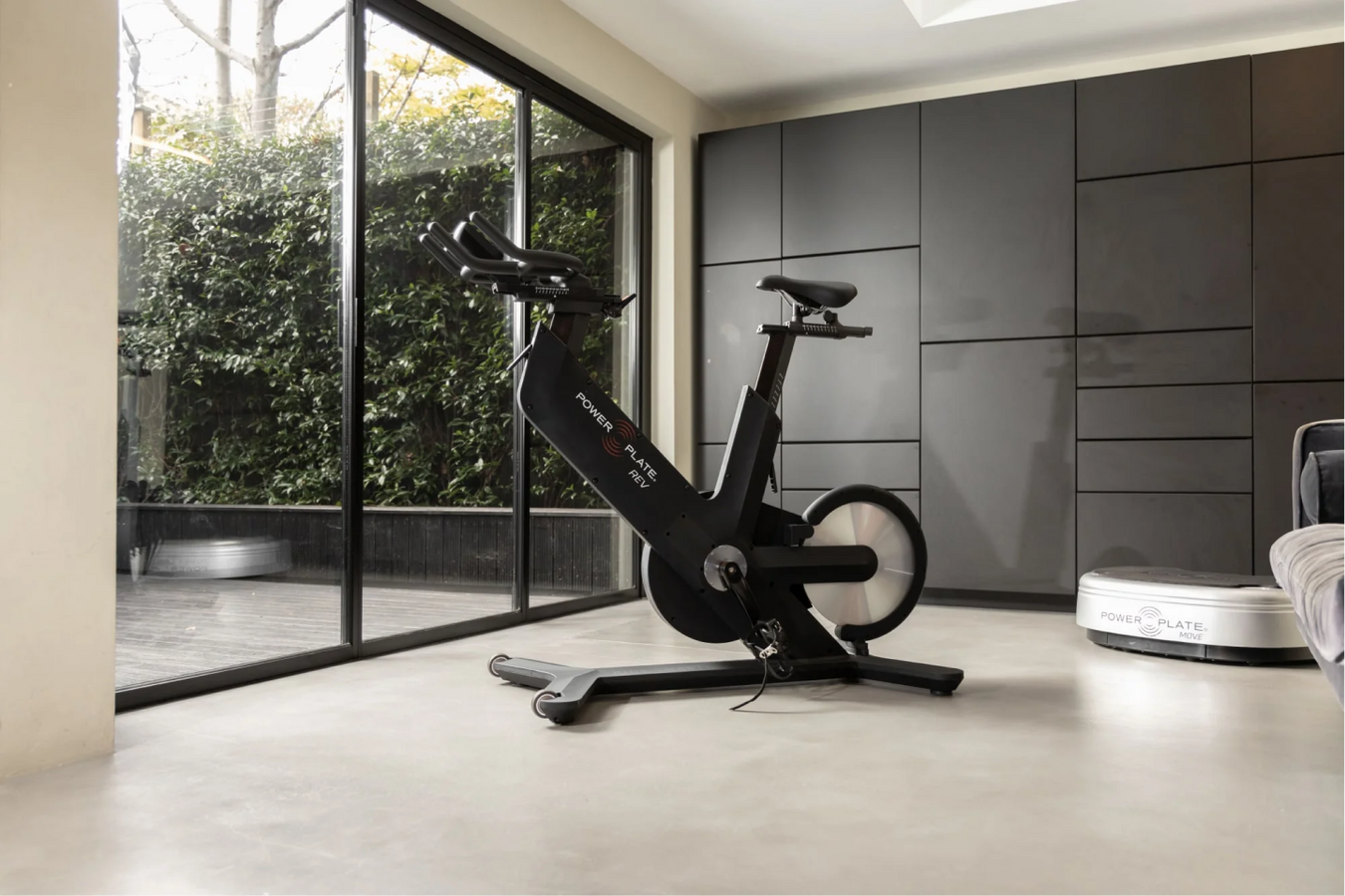 Power Plate REV™ Exercise Bike inside the workout room