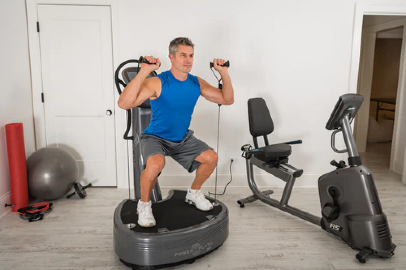 Person using the Power Plate Vibrating Exercise Machine