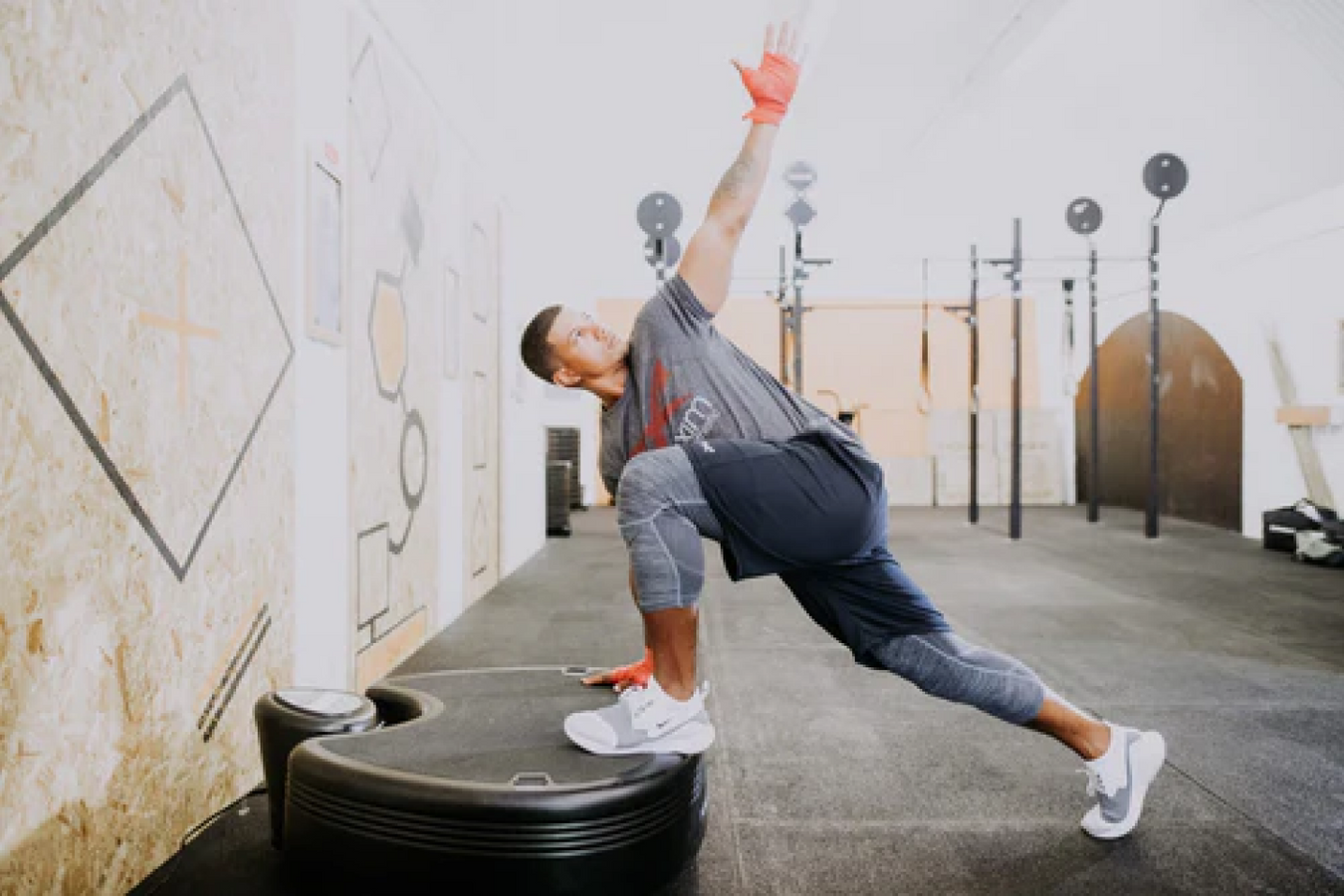 Person using the Power Plate Whole Body Vibration Machine in the workout room