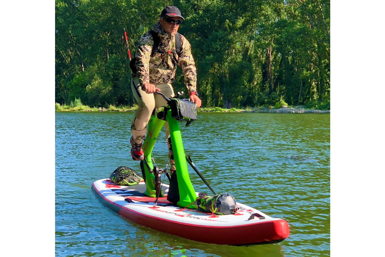 A man on a Red Shark Water Bike on the water