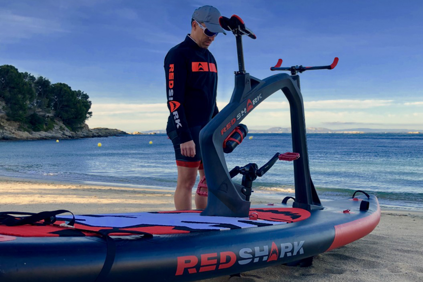 Red Shark Aqua Cycle setting off of the beach side